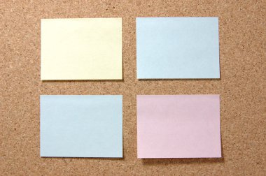 Colorful post-it notes on corkboard clipart