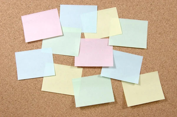 Colorful post-it notes on corkboard — Stock Photo, Image