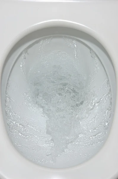 Flushing toilet — Stock Photo, Image