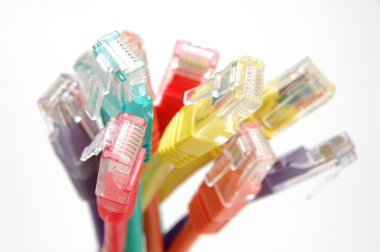 Close up of multi color network cable plugs clipart