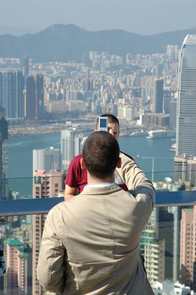 stock image Young man taking photo for his friend