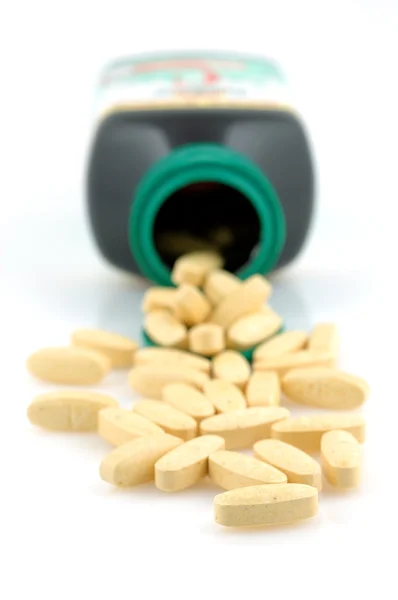 Garrafa de pílulas vitamínicas — Fotografia de Stock