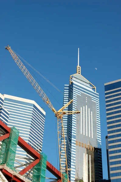Crane and business buildings — Stock Photo, Image