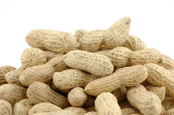Haufen ungeschälter Erdnüsse — Stockfoto