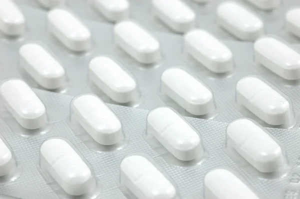 Ból głowy tabletki tło — Zdjęcie stockowe