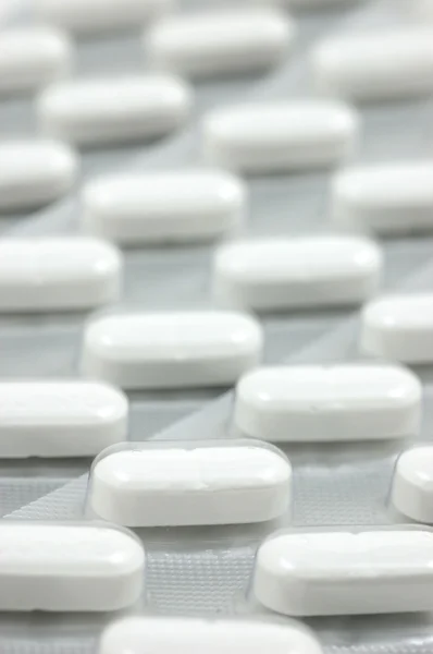 Fejfájás tabletták háttér — Stock Fotó