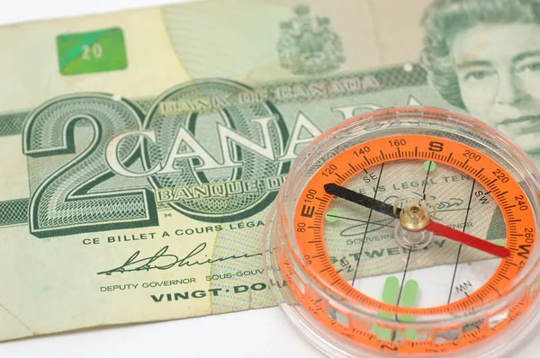 Kompass på Kanada dollar bill — Stockfoto