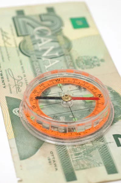 Bússola em nota de dólar canadense — Fotografia de Stock