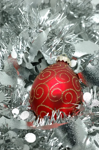 Christmas ball over silver garland Stock Photo
