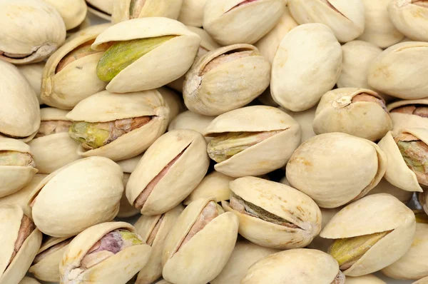 Pimpernoten (pistaches) noten achtergrond — Stockfoto
