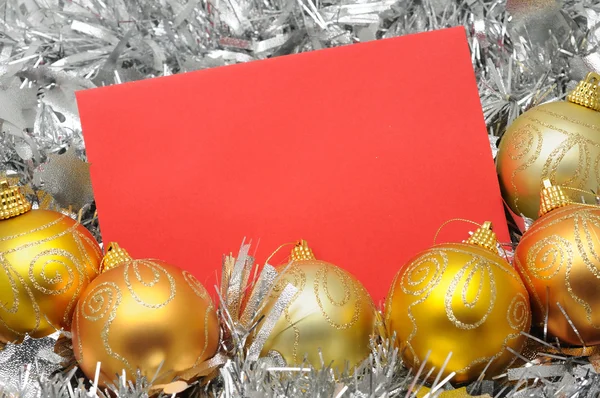 Golden christmas balls and card — Stock Photo, Image
