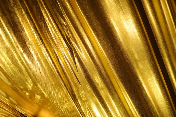 Złoty tkanina tło — Zdjęcie stockowe