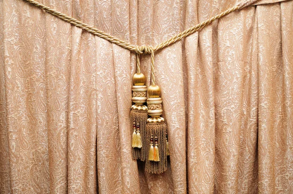 Gouden gordijn met vassel — Stockfoto