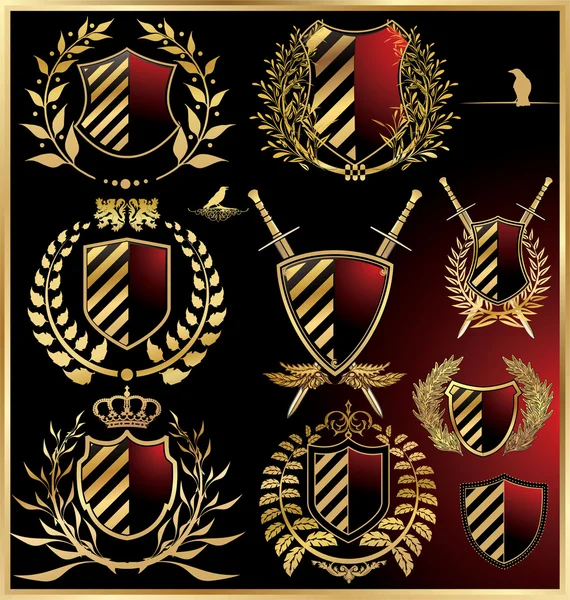 Conjunto de vectores de los escudos negros con laurel dorado — Archivo Imágenes Vectoriales