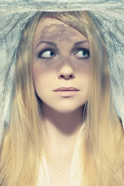 Beautiful young woman under a veil — Stock Photo, Image