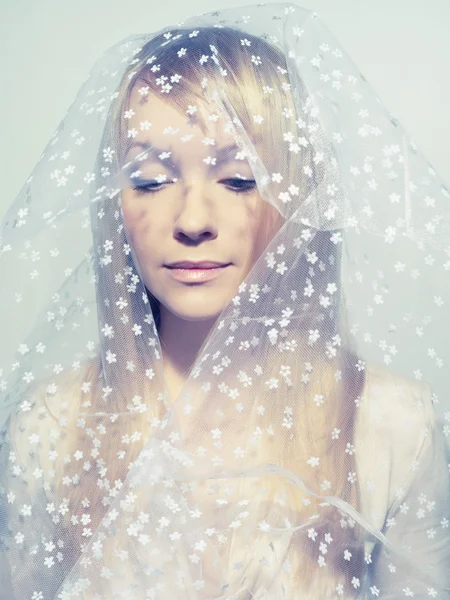 Beautiful young woman under a veil — Stock Photo, Image