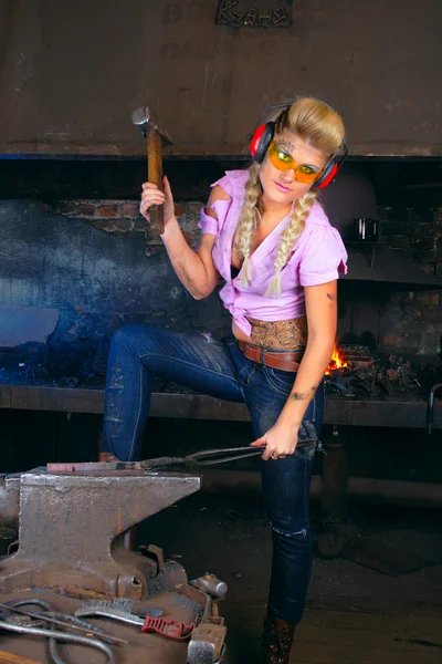 Attractive girl in the smithy — Stock Photo, Image
