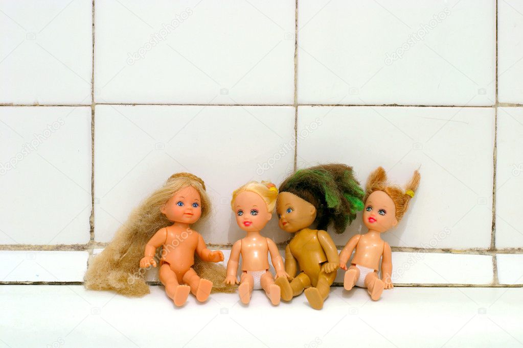 Dolls on the bath edge