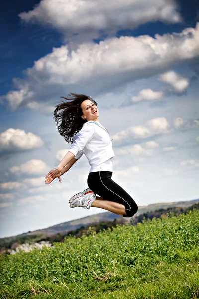 Jumping woman Royalty Free Stock Photos