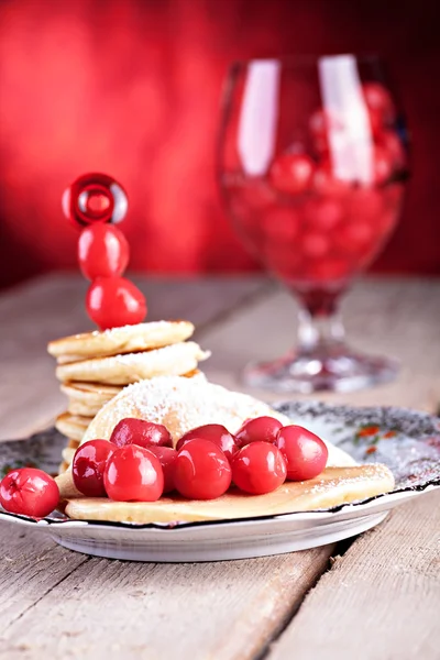 Pancakes with cherries — Stock Photo, Image