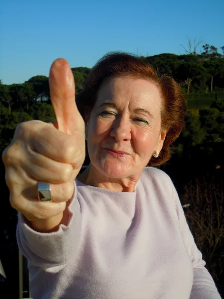 stock image Senior woman with thumb up