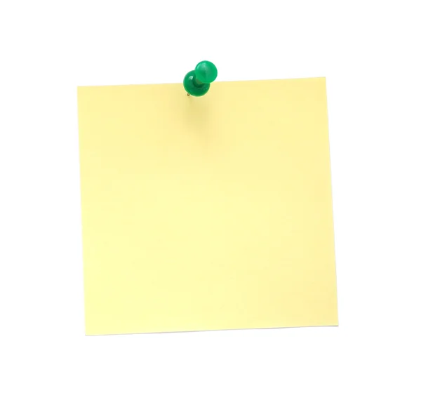 Poznámka: žlutý papír s zeleným připínáček — Stock fotografie