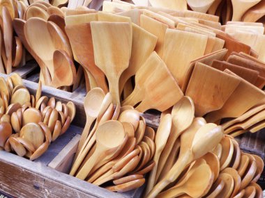 Different Sized and Shaped Wooden Spoons on Market clipart