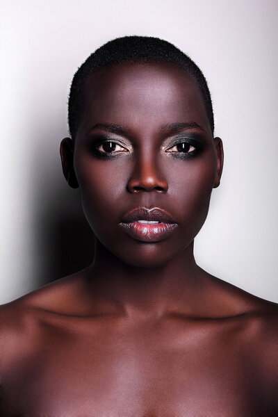 Black African young sexy fashion model studio portrait isolated white black