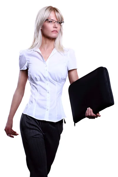 Young attractive blonde business women serious wearing glasses holding a folder in an office environment walking — Stock Photo, Image