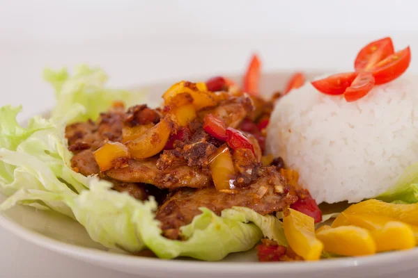 Fried pieces of pork with rice — Stock Photo, Image