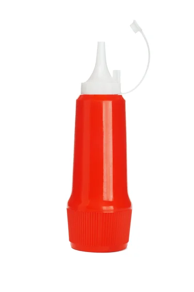 Красная пластиковая бутылка кетчупа — стоковое фото