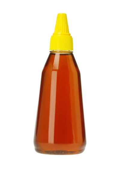 Bouteille en plastique de miel — Photo