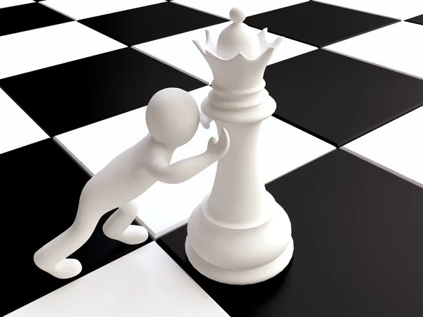 Чоловік штовхає фігуру королеви шахів — стокове фото