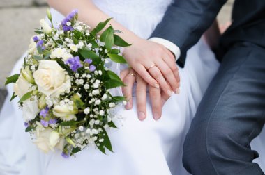 Bride and groom's hands clipart