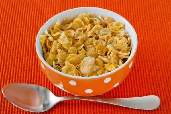 Cornflakes in the bowl with spoon — Stock Photo, Image