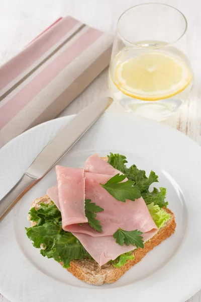 Toast with lettuce, ham and parsley — Stock Photo, Image