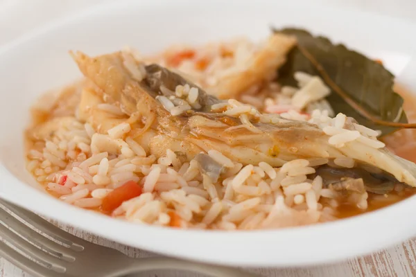 Rice with fish on the white plate — Stock Photo, Image