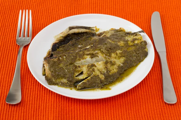 stock image Fish with sauce pesto on th plate