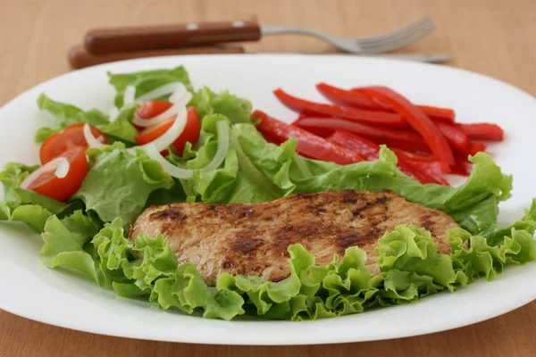 Fried pork with salad — Stock Photo, Image