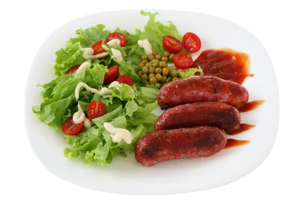 Fried sausages with salad — Stock Photo, Image