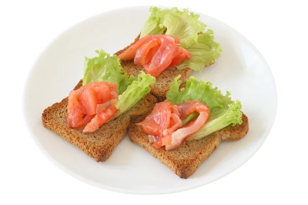 Toasts with salted salmon — Stock Photo, Image