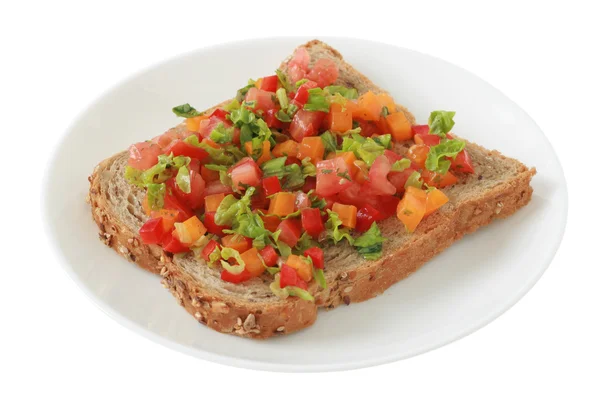 Toast with cut vegetables — Stock Photo, Image