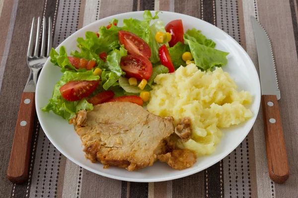 Pork with mashed potato and salad — Stock Photo, Image