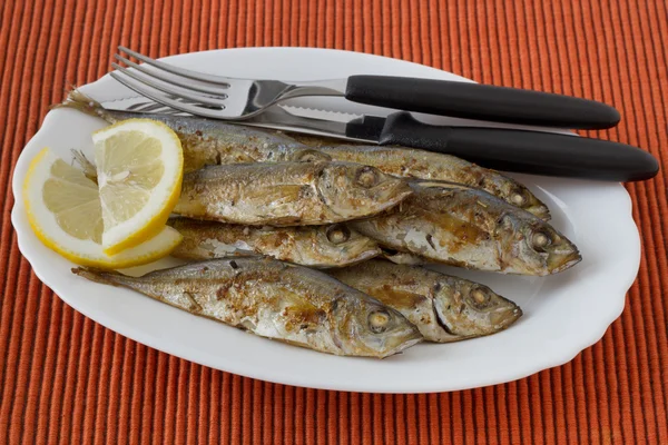 stock image Fried fish with lemon