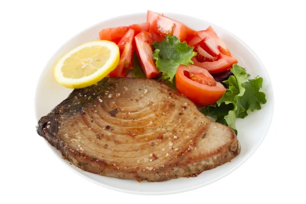 Stekt tonfisk med sallad och citron på plattan — Stockfoto