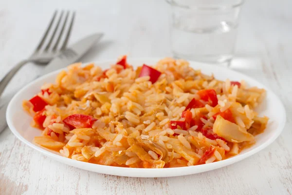Rice with codfish and vegetables on the plate — Stock Photo, Image