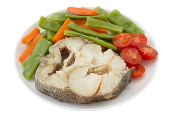 Peixe cozido com legumes no prato — Fotografia de Stock