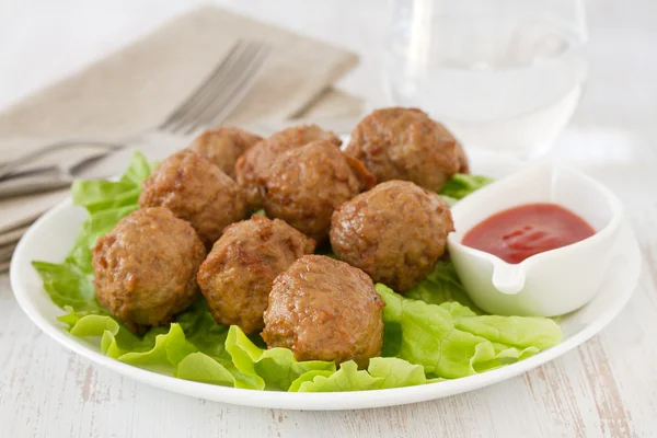 Meatballs on the plate with sauce — Stock Photo, Image