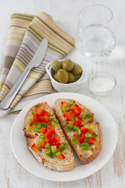Toasts with cut pepper on the plate — Stock Photo, Image
