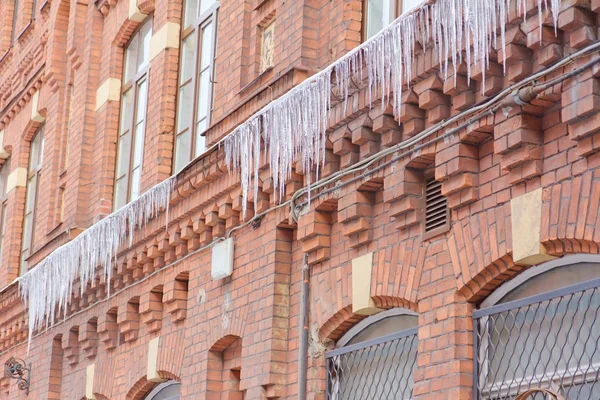 stock image Icicles on a brick wal